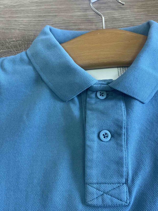 Piqué polo shirt on a hanger